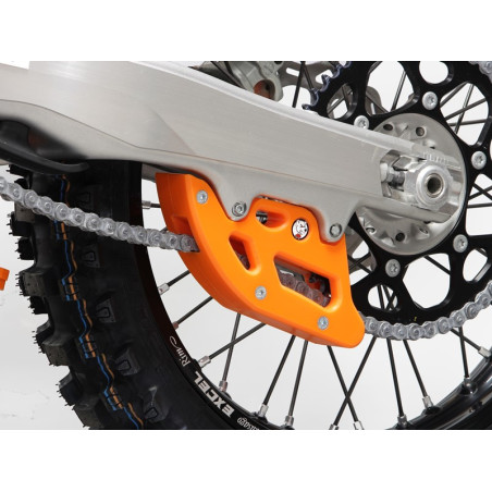 Side view of the orange chain guide in UHMW plastic for KTM