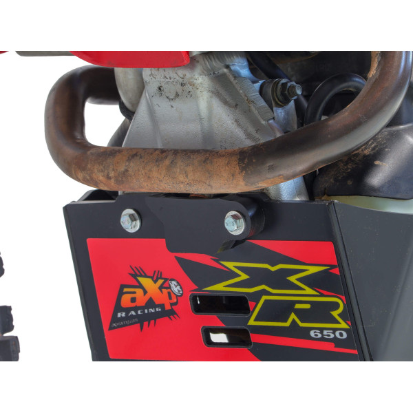 Close up view of the oil draining screw of the 6mm black HDPE plastic skid plate with linkage guard for Honda XR650R