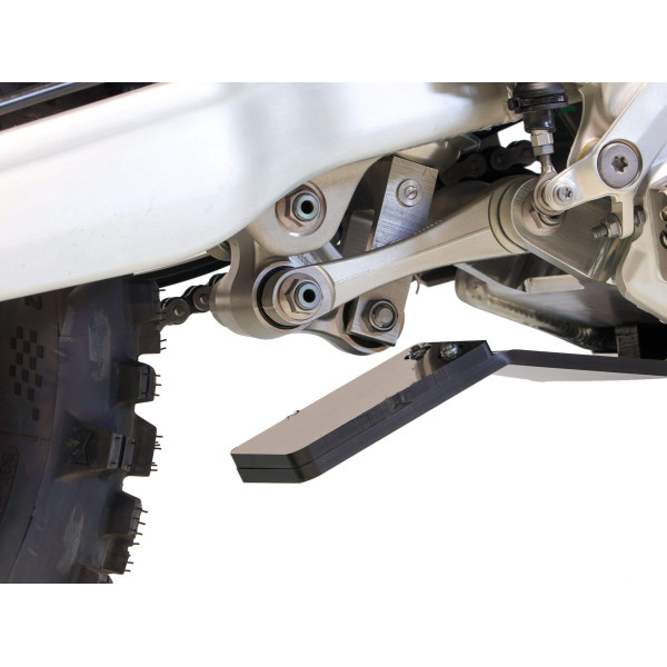 Close up view of the linkage guard of the black HDPE plastic skid plate for Triumph TF450-RC and TF450-E
