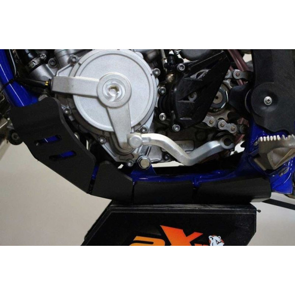 Side view of the black HDPE plastic skid plate with linkage guard for Sherco 125SER