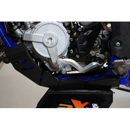 Side view of the black HDPE plastic skid plate with linkage guard for Sherco 125SER