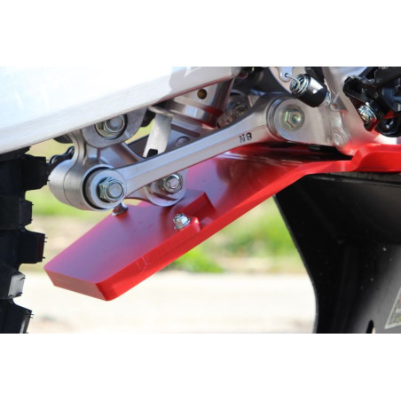 Close up view of the linkage guard of the red HDPE plastic skid plate for Honda CRF450R